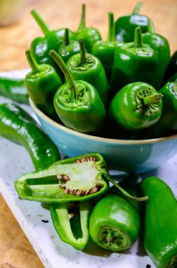 Fresh green mild padron pepper pementos, ready for grill or to b