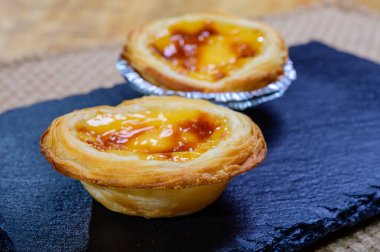 Portugal's traditional sweet dessert Pastel de nata egg custard tart pastry in cup