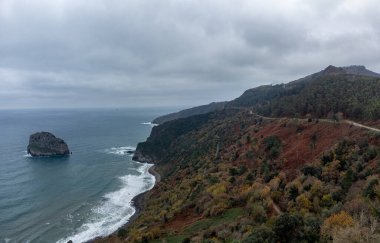 Atlantic ocean coastline near famous landmark and film location in North of Spain, ocean islet with chapel San juan de Gaztelugatxe, Basque Country, Spain in wintertime