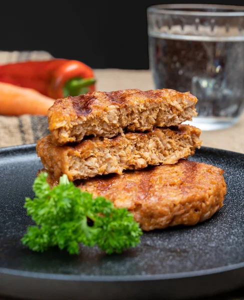 Tasty grilled vegan burgers made from vegetarian plant based soya beans imitation meat healthy lifestyle