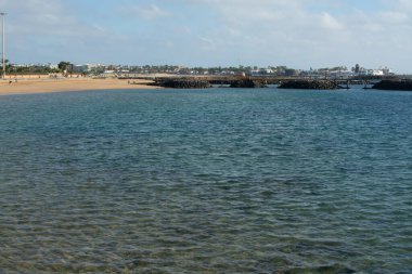 Winter sea and sun vacation in Caleta de Fuste touristic village on Fuerteventura, Canary islands, Spain