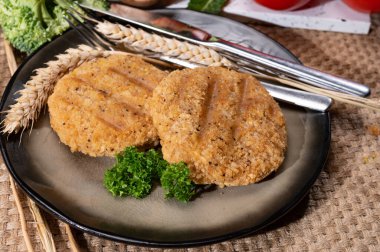 Source of fibre plant based vegan wheat protein grilled burgers, meat free vegetarian healthy food close up