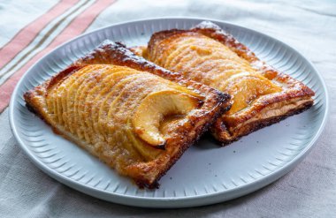 Tasty sweet French dessert, baked apple cakes, Normandy region, France, close up