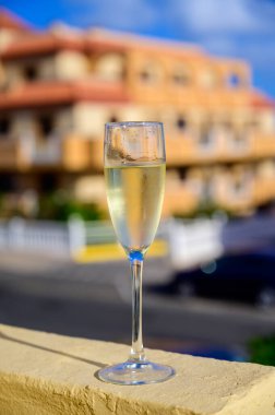 Dinner party, drinking of cava or champagne sparkling wine in vacation resort Caleta Fuste, Fuerteventura, Canary islands winter sun vacation, Spain