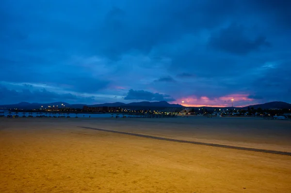 Stock image Sandy beach after sunset. Winter sea and sun vacation in Caleta de Fuste touristic village on Fuerteventura, Canary islands, Spain