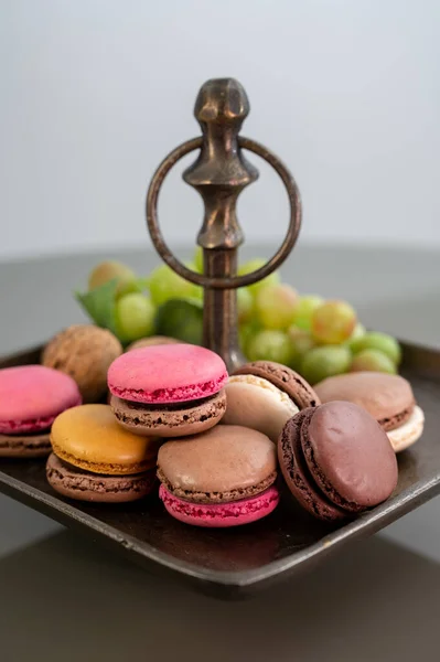 Macarons or French macaroon  sweet meringue-based confection made with egg white, icing sugar, granulated sugar, almond meal, and food colouring, sweet french dessert