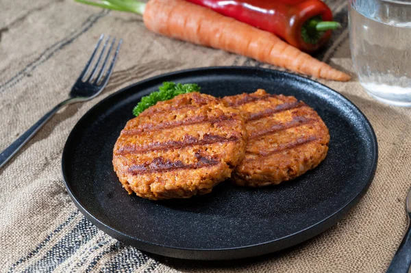 Tasty grilled vegan burgers made from vegetarian plant based soya beans imitation meat healthy lifestyle