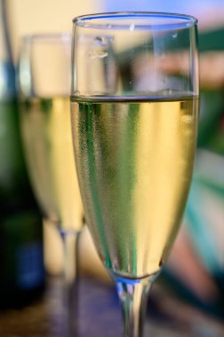 Dinner party, drinking of cava or champagne sparkling wine in vacation resort Caleta Fuste, Fuerteventura, Canary islands winter sun vacation, Spain