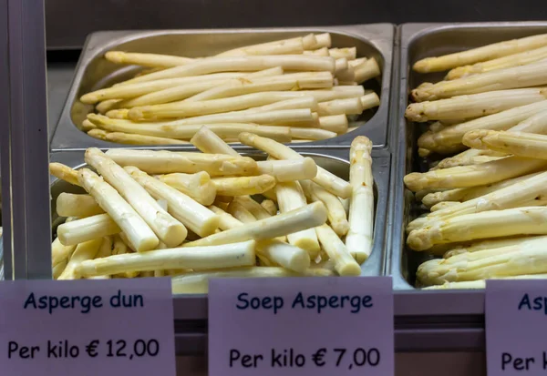 First Dutch white washed asparagus for sale on farm in North Brabant, english translation - soup asparagus price 1 kilo 7 euro, thick asparagus price 1 kilo 12 euro, close up