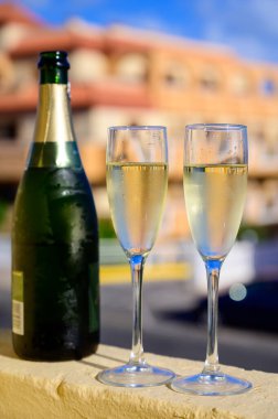 Dinner party, drinking of cava or champagne sparkling wine in vacation resort Caleta Fuste, Fuerteventura, Canary islands winter sun vacation, Spain