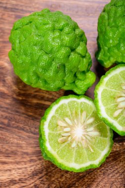 Citrus hystrix, green kaffir lime or makrut lime, citrus fruit native to tropical Southeast Asia. Fruit and leaves used in Southeast Asian cuisine, essential oil is used in perfumery for intense citrus fragrance.