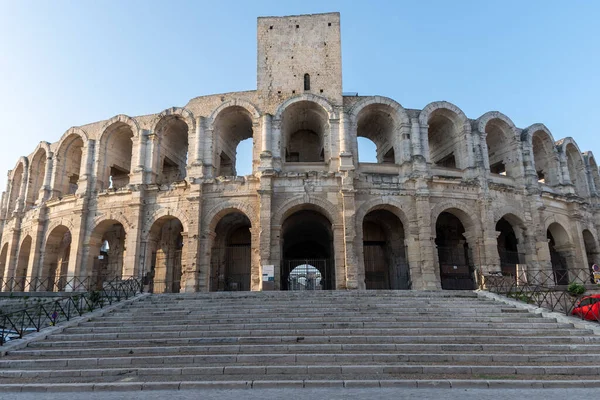 View on old Roman Arena in ancient french town Arles, touristic destination with Roman ruines, Bouches-du-Rhone, France.