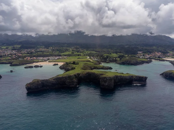 stock image Vacation on Green coast of Asturias, aerial views near Celorio village with sandy beaches, North of Spain.