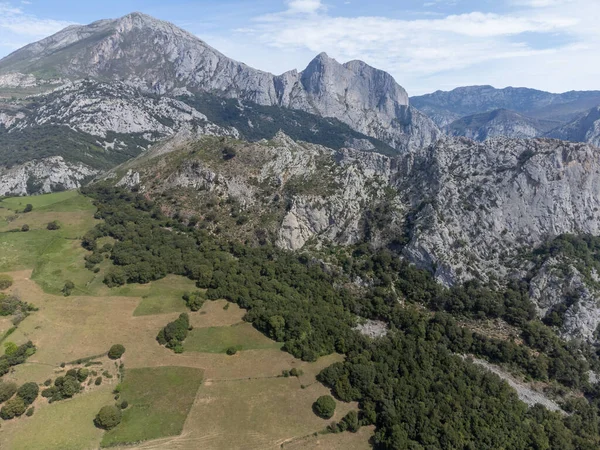 stock image Aerial views of green Liebana valley, houses and mountains,  comarca of Cantabria, Spain.