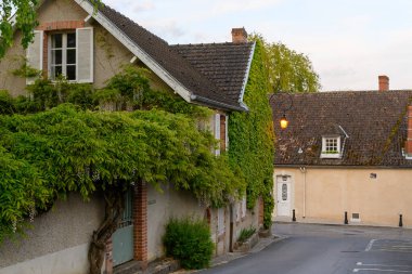 Walking in touristic old village with abbey Hautvillers, cradle of sparkling wine champagne, France. clipart