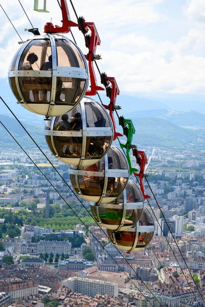 stock image View on central part of Grenoble city from Bastille fortres witn mountains around, old cable car, Isere, France in summer