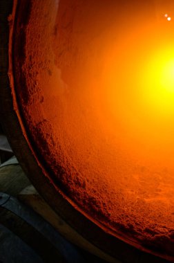 Sediment in barrels, traditional wa of making champagne sparkling wine from chardonnay and pinor noir grapes in grand cru village Oger, Champagne, France