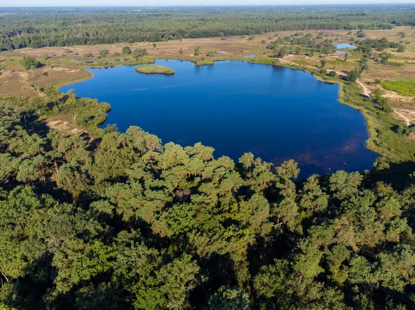 stock image Aerial view on forest and lakes. Sunny summer morning in Nature protected park area De Malpie near Eindhoven, North Brabant, Netherlands. Nature landscapes in Europe.