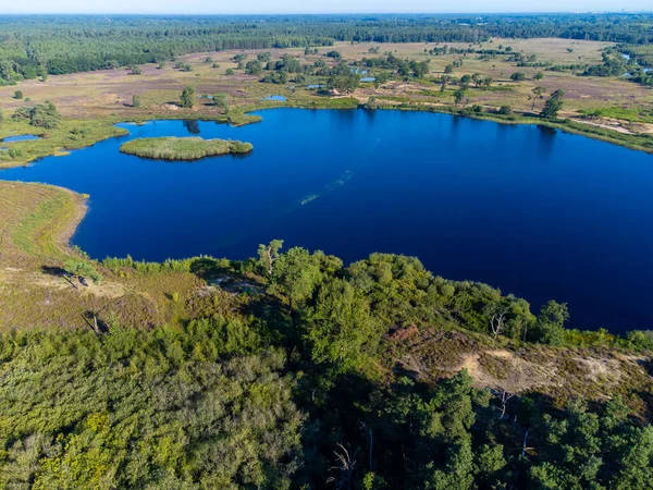 stock image Aerial view on forest and lakes. Sunny summer morning in Nature protected park area De Malpie near Eindhoven, North Brabant, Netherlands. Nature landscapes in Europe.