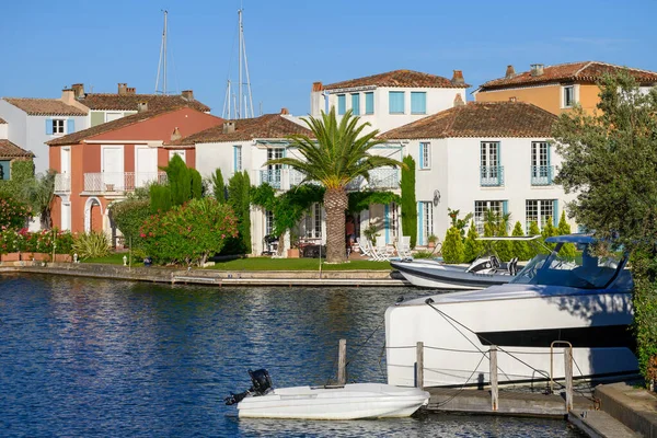 Colorful houses in Port Grimaud, village on Mediterranean sea with yacht harbour, Provence, summer vacation in France.