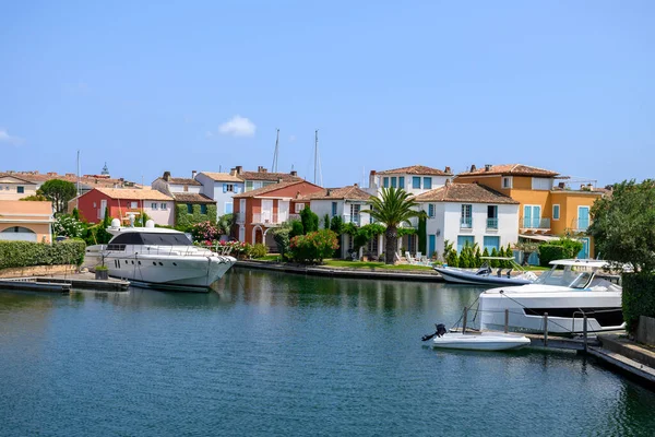 Colorful houses in Port Grimaud, village on Mediterranean sea with yacht harbour, Provence, summer vacation in France.