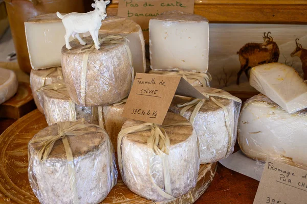 Farmer shop in La Grave ski village, Hautes Alpes, France, cheese for sale, lettering in French means Tomme from goat milk, farmers cheese, close-up