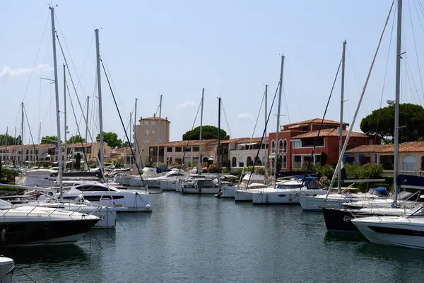 Colorful houses in Port Grimaud, village on Mediterranean sea with yacht harbour, Provence, summer vacation in France.