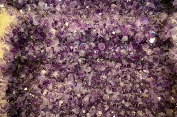 Large violet amethyst stone semiprecious crystal close up background