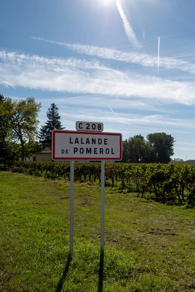 City road sign Lalande de Pomerol near Saint-Emilion wine making region, growing of Merlot or Cabernet Sauvignon red wine grapes, France, Bordeaux in summer