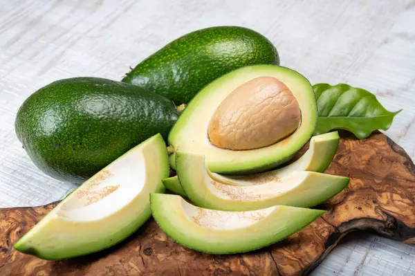 Green ripe avocado fruits from organic avocado plantation - healthy vegan and vegetarian food