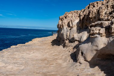 Oldest rocks of Canary Islands in cave network in town of Ajuy, north of Pajara, geological wonder consists of sedimentary substrates formed in deep ocean, Cretaceous period clipart