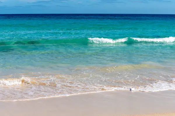 Caleta del bajo, corralejo grandes playas white sandy beaches with blue water near Corralejo touristic town on north of Fuerteventura, Canary islands, Spain