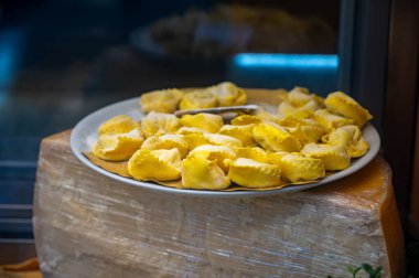 Italian food, fresh homemade stuffed pasta tortelli or ravioli dumplings ready to cook on display, Milan, Lombardy, Italy clipart