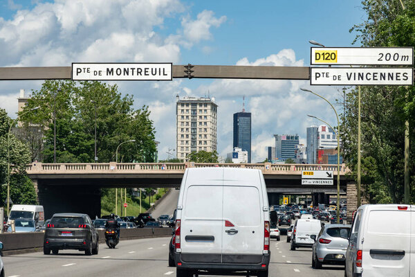 Driving in heavy summer traffic on ring road of capital of France, traffic jam and transportation problems in Paris