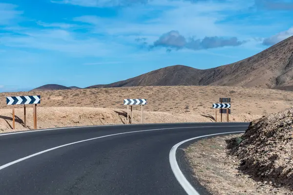 stock image Mountain asphalt road on colourful remote basal hills and mountains of Massif of Betancuria, Fuerteventura, Canary islands, Spain, travel destination
