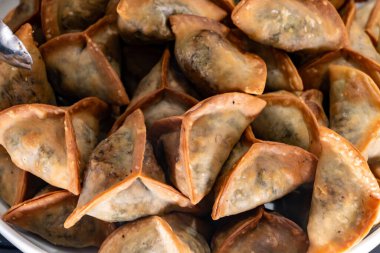 Lebanese Spinach Pies traditional Fatayer fried in oil close up clipart