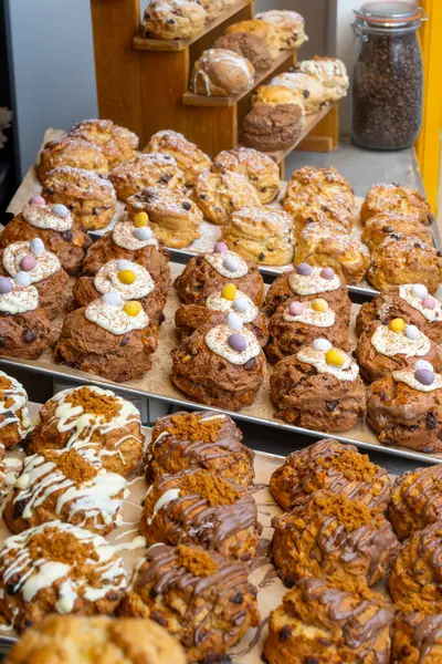 stock image Scones - traditional British baked good, popular in the United Kingdom and Ireland, tea buns make with yeast with different toppings, close up