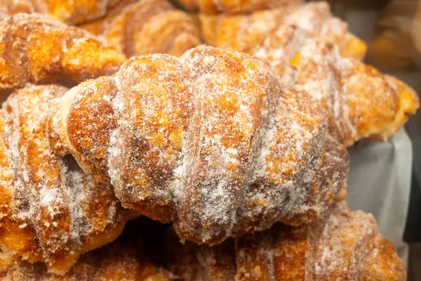 stock image Fresh baked french pastries for breakfast, almond croissant with almond cream filling