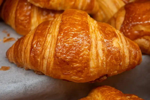 stock image Breakfast in France, fresh baked butter croissants in artisanal bakery in Paris, France, close up