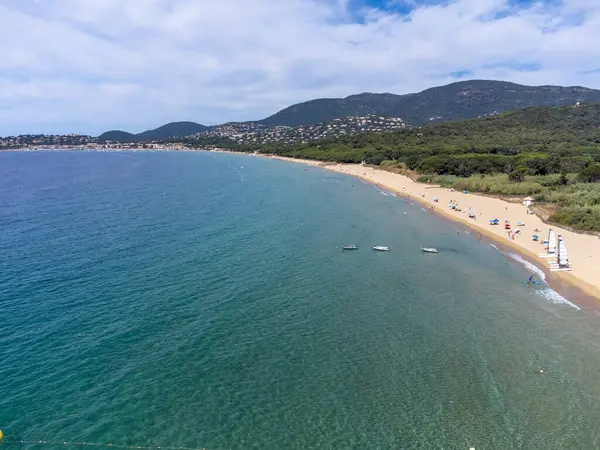 stock image Aerial view on boats, crystal clear blue water of Plage du Debarquement white sandy beach near Cavalaire-sur-Mer and La Croix-Valmer, summer vacation on French Riviera, Var, Provence, France