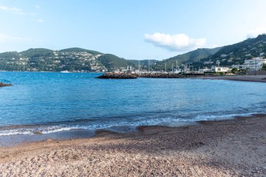 Coastline with stones, bays, castle in Mandelieu-la-napoule near Cannes, French Riviera, France in summer clipart