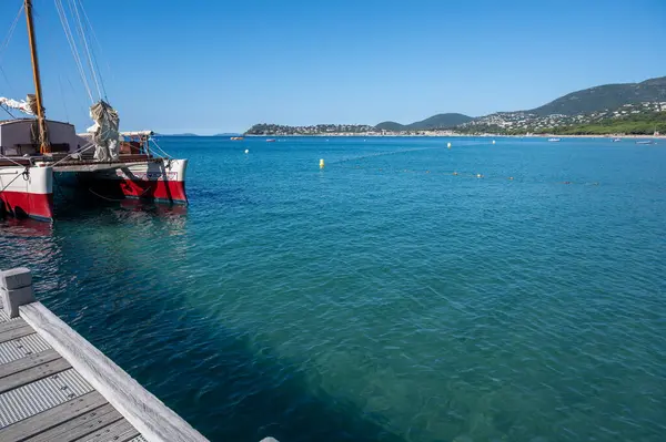 stock image Morning view on crystal clear blue water and pier of Plage du Debarquement white sandy beach near Cavalaire-sur-Mer and La Croix-Valmer, summer vacation on French Riviera, Var, France