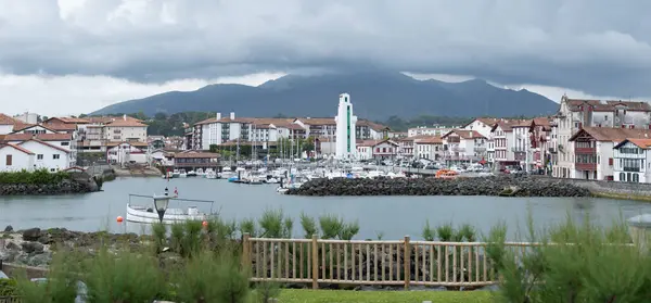 stock image White houses, lighthouse and port of old part of Ciboure and Saint-Jean-de-Luz on Basque coast, famous resort, known for beautiful architecture, sandy beaches, cuisine, South of France, Basque Country