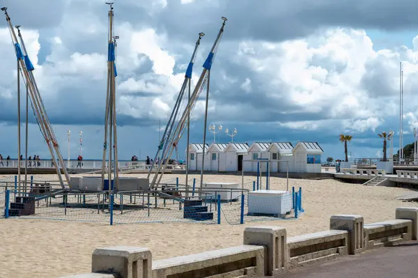 stock image Walking on beach promenade in sunny Arcachon, vacation destination town on Atlantic coast with beatiful parks, villas, streets and sandy beach and pine trees, France