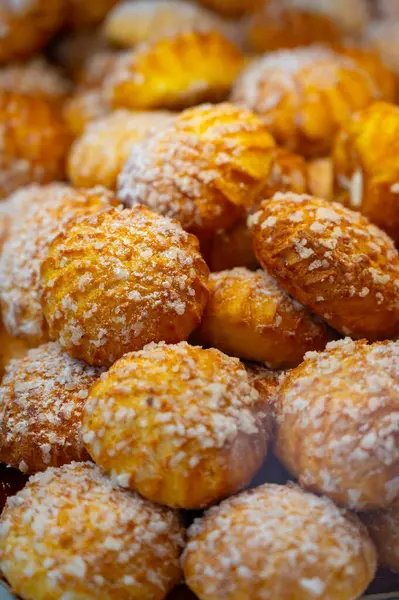 stock image Many Chouquettes or petits choux are small pieces French patisserie consisting of small spheres of choux pastry, sugared and baked, Bordeaux, France