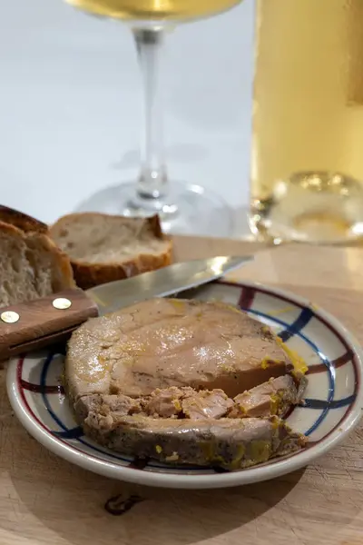 stock image Starter dish Foie gras fat liver specialty food product made of liver of a duck or goose fattened by gavage, force feeding, served with wine in French restaurant in Perigoed, Dordogne, close up