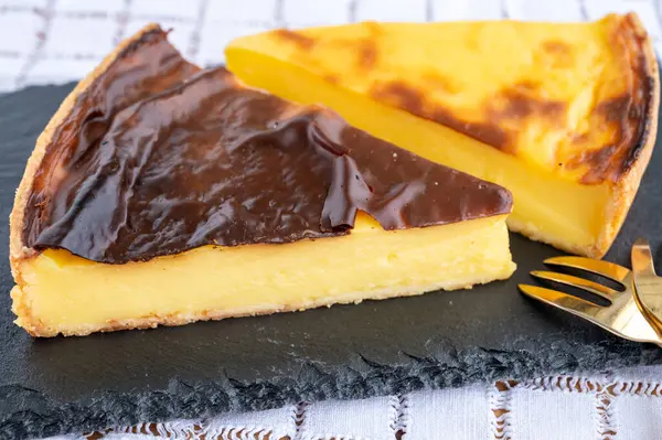 stock image Sweet dessert, pieces of cheesecake or custard flan, close up