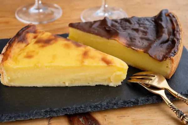 stock image Sweet dessert, pieces of cheesecake or custard flan, close up