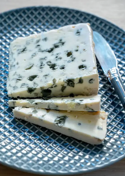 stock image Piece of French blue cheese Roquefort, made from sheep milk in caves of Roquefort-sur-Soulzon, France