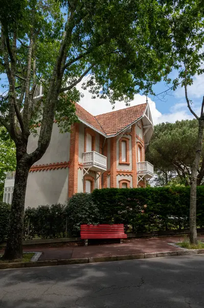 stock image Walking in sunny Arcachon, vacation destination town on Atlantic coast with beatiful parks, villas, streets and sandy beach and pine trees, France